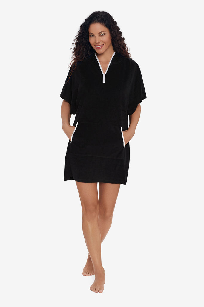 Woman wearing a pull over swim cover up with white trim detail