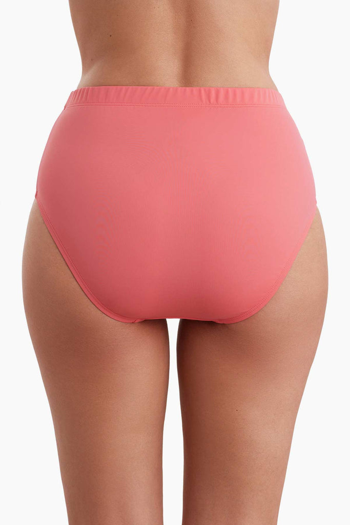 Back view of a coral pink basic brief swim bottom