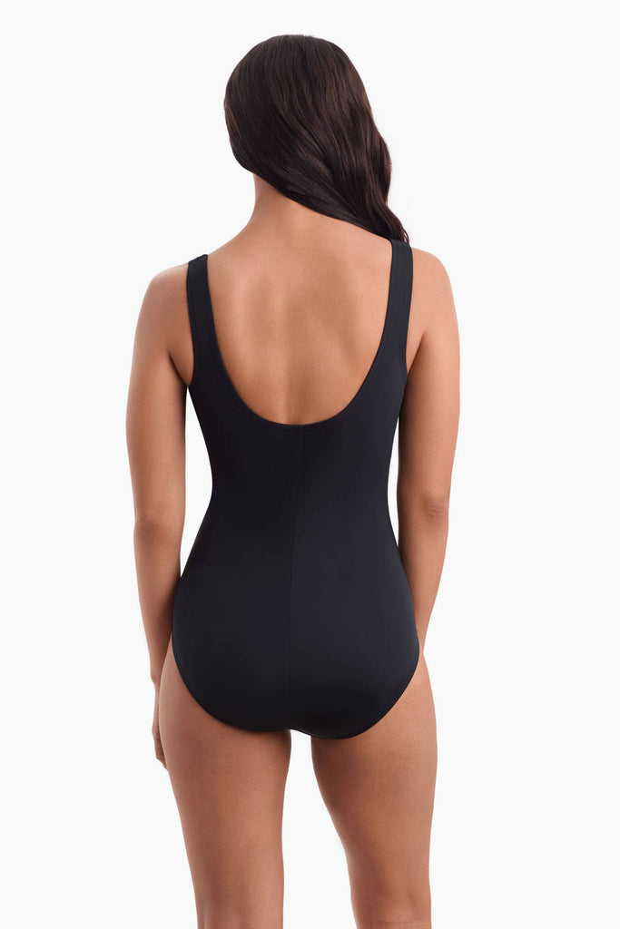 Woman facing away to show back of one-piece swimsuit