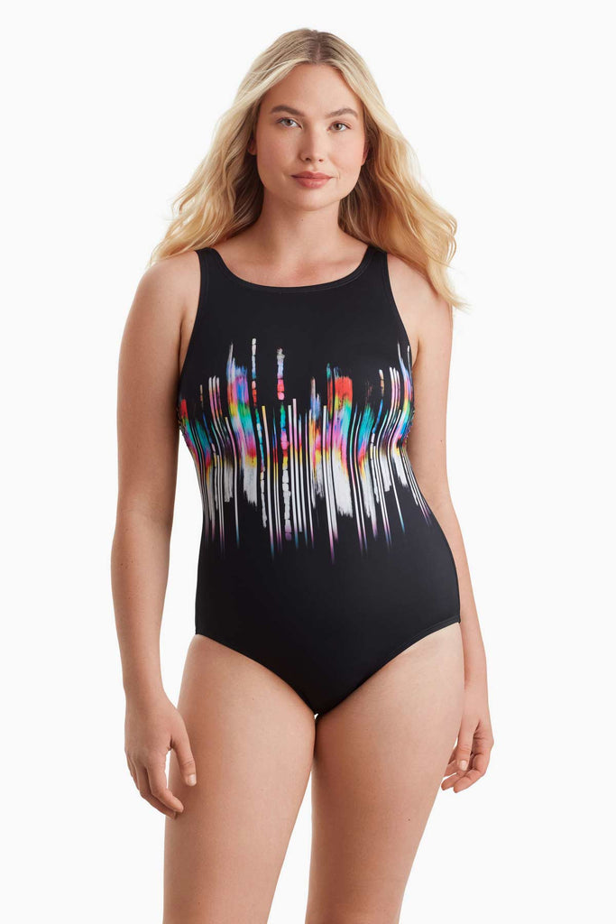 Woman wearing a one-piece swimsuit with a colorful design in the center