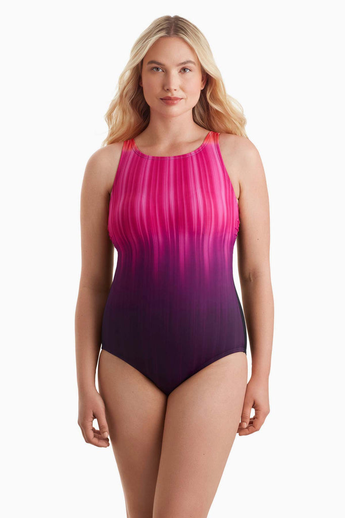 Woman wearing a one-piece swimsuit with a pink streak pattern