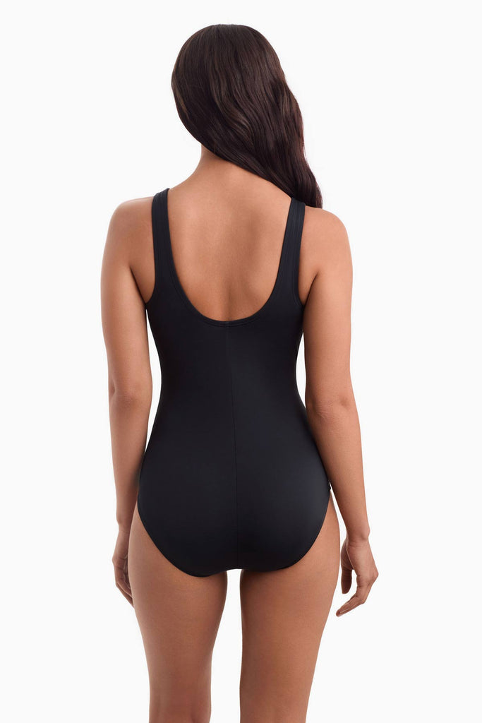 Woman facing away wearing a one-piece swimsuit