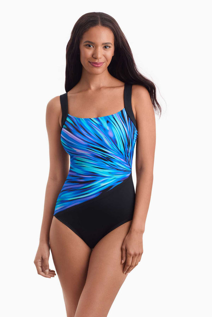 Woman facing forward wearing a blue multicolored one-piece swimsuit