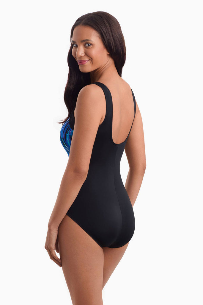 Woman facing left to show off detail of one-piece swimsuit