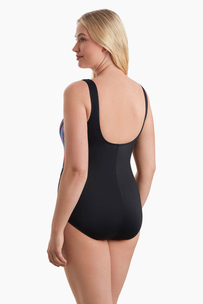 Woman faced left to show detail of one-piece swimsuit