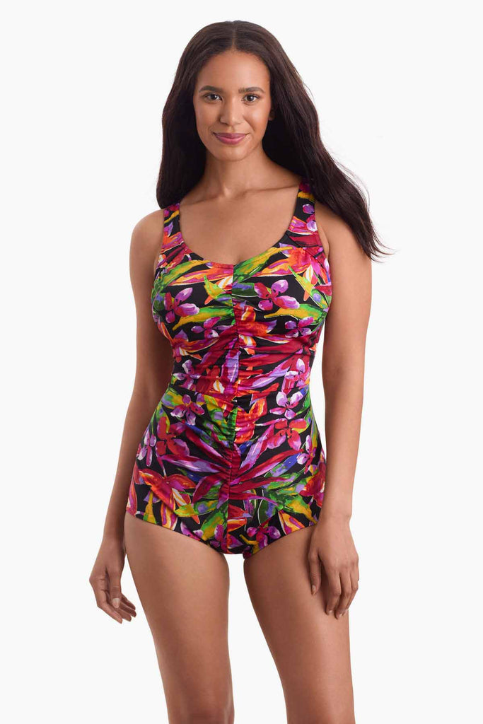 Woman wearing a multicolored swimsuit with a floral print