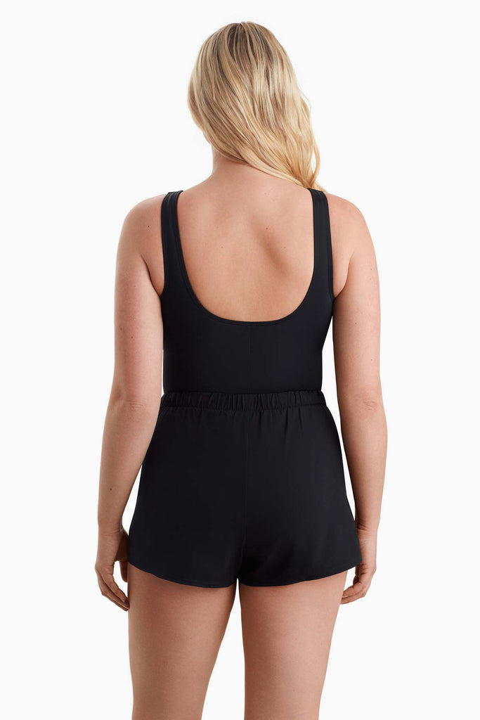 Woman turned away to show off back of swimsuit