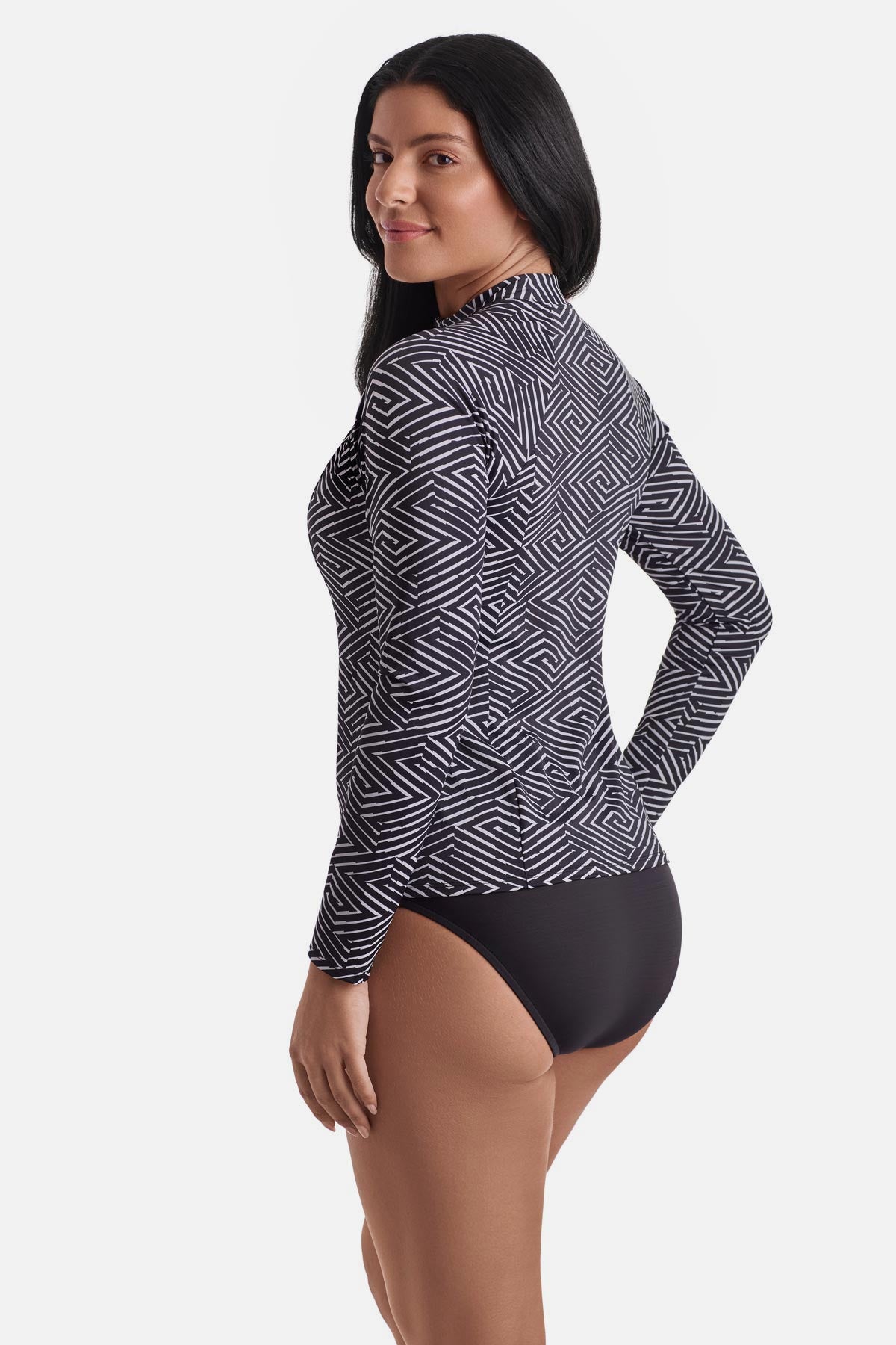 Woman turned left wearing a black and white maze pattern sunshirt